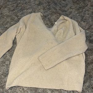 V neck cream sweater tie back size small. Looks great styled with leather pant